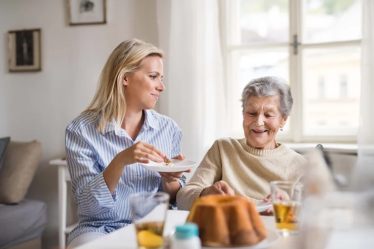 Woman communicating with a dementia patient